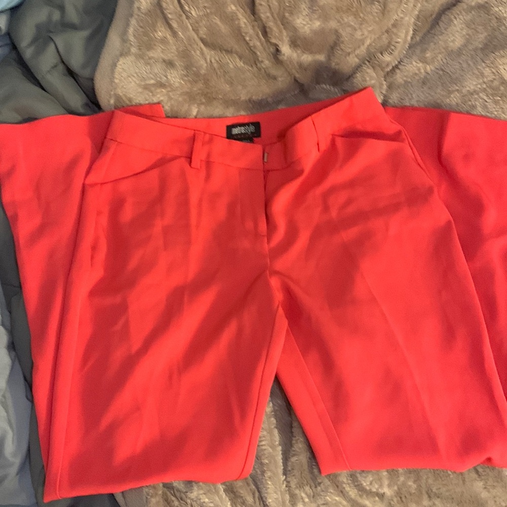 Red slacks with back pockets